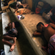 Ethnic Rohingya youths sleep inside a sports stadium turned into temporary shelter for migrants whose boats washed ashore on Sumatra island on Sunday, in Lhoksukon, Aceh province, Indonesia, Wednesday, May 13, 2015. Abandoned at sea, thousands of Bangladeshis and members of Myanmar's long-persecuted Rohingya Musilm minority appear to have no place to go after two Southeast Asian nations refused to offer refuge to boatloads of hungry men, women and children.